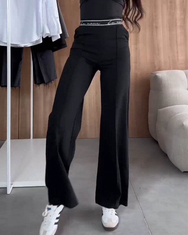 Pantalon droit décontracté de couleur unie avec poche zippée